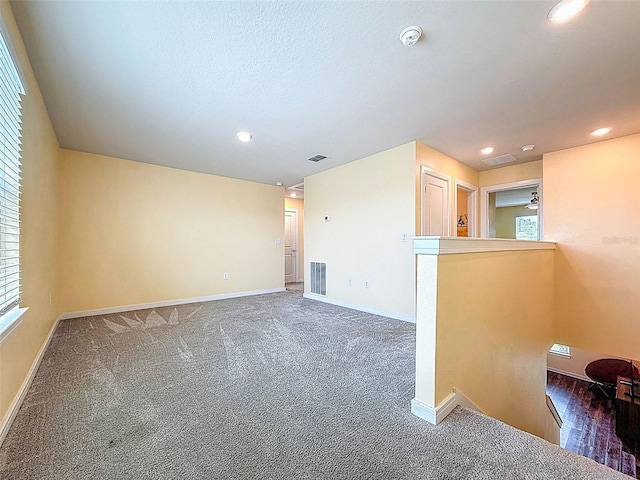 9324 Rally Spring Loop, Wesley Chapel, FL 33545 - unfurnished room with baseboards, recessed lighting, carpet, and a smoke detector