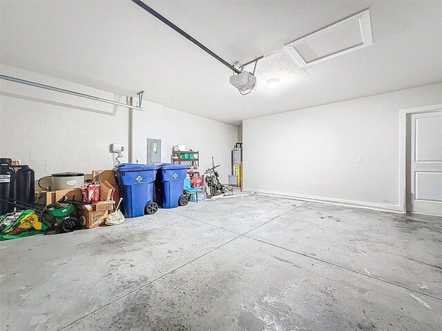 9324 Rally Spring Loop, Wesley Chapel, FL 33545 - garage with electric panel and a garage door opener
