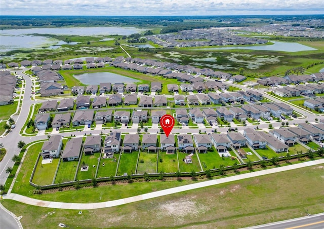 9324 Rally Spring Loop, Wesley Chapel, FL 33545 - aerial perspective of suburban area with a large body of water