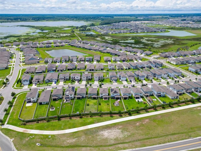 9324 Rally Spring Loop, Wesley Chapel, FL 33545 - aerial view of residential area with a nearby body of water