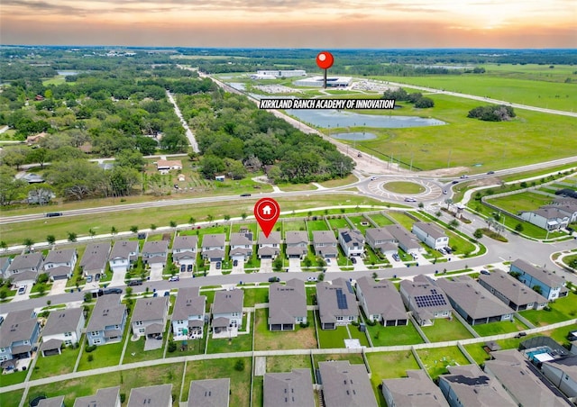 9324 Rally Spring Loop, Wesley Chapel, FL 33545 - aerial view at dusk of a water view and a residential view