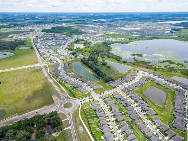 9324 Rally Spring Loop, Wesley Chapel, FL 33545 - aerial view of property and surrounding area featuring a nearby body of water and nearby suburban area
