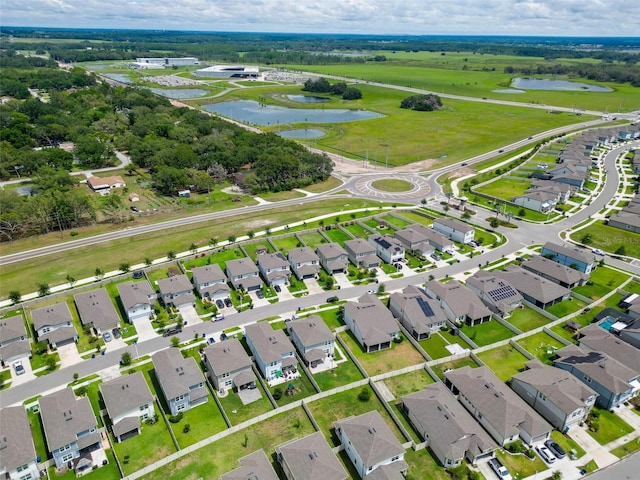 9324 Rally Spring Loop, Wesley Chapel, FL 33545 - aerial view of property and surrounding area featuring a large body of water and nearby suburban area
