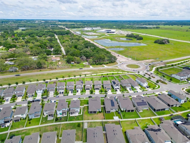 9324 Rally Spring Loop, Wesley Chapel, FL 33545 - aerial perspective of suburban area with a large body of water