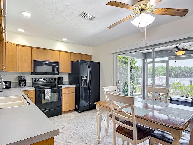 11122 W Cove Harbor Dr Unit 112, Crystal River, FL 34428 - kitchen with black appliances, a sink, light countertops, a ceiling fan, and recessed lighting
