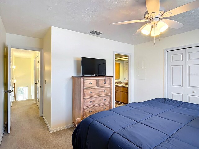 11122 W Cove Harbor Dr Unit 112, Crystal River, FL 34428 - bedroom featuring light carpet, baseboards, a closet, and ceiling fan