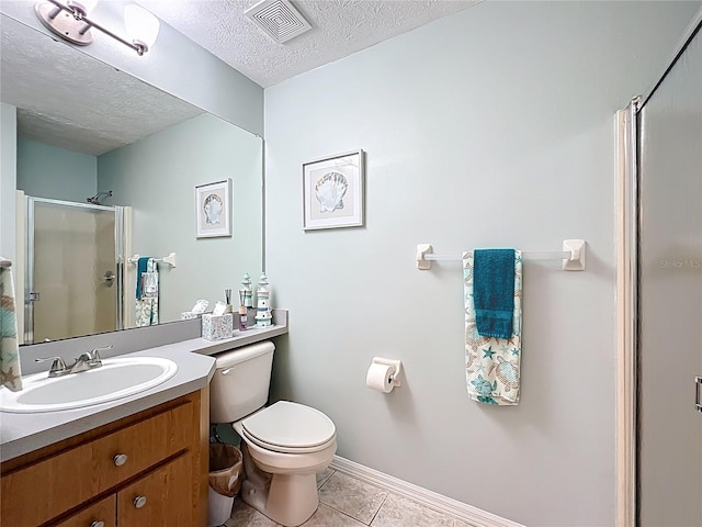11122 W Cove Harbor Dr Unit 112, Crystal River, FL 34428 - full bath featuring a stall shower, tile patterned floors, a textured ceiling, toilet, and vanity