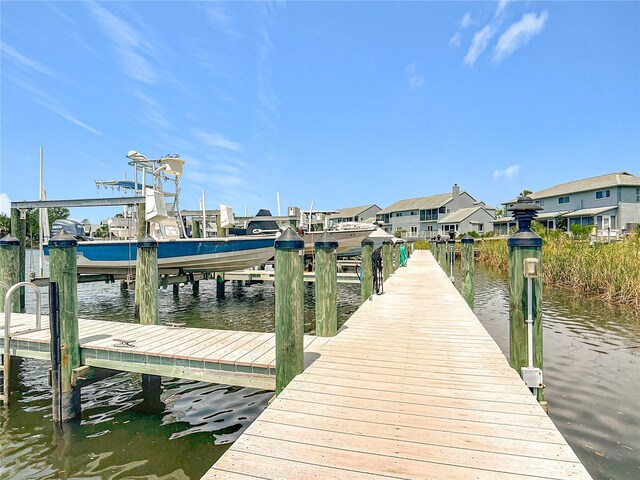 11122 W Cove Harbor Dr Unit 112, Crystal River, FL 34428 - dock area with boat lift and a water view
