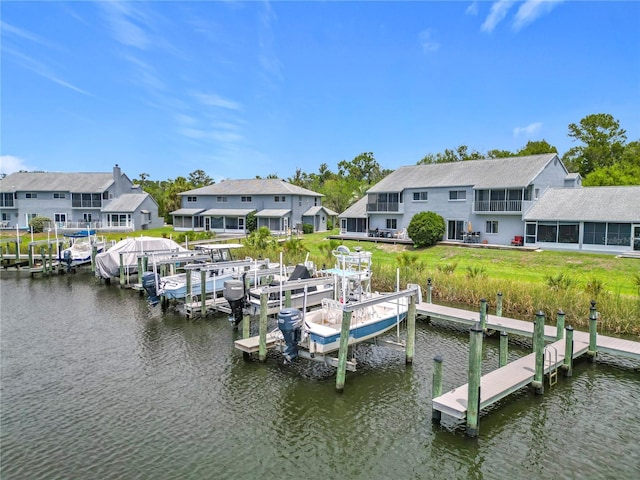11122 W Cove Harbor Dr Unit 112, Crystal River, FL 34428 - dock area featuring a water view, boat lift, and a lawn