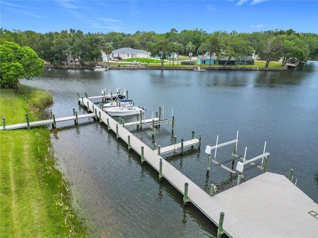 11122 W Cove Harbor Dr Unit 112, Crystal River, FL 34428 - dock area featuring boat lift, a water view, and view of scattered trees