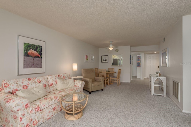 1241 S Martin Luther King Jr Ave Unit 302, Clearwater, FL 33756 - living area with ceiling fan, carpet floors, and a textured ceiling