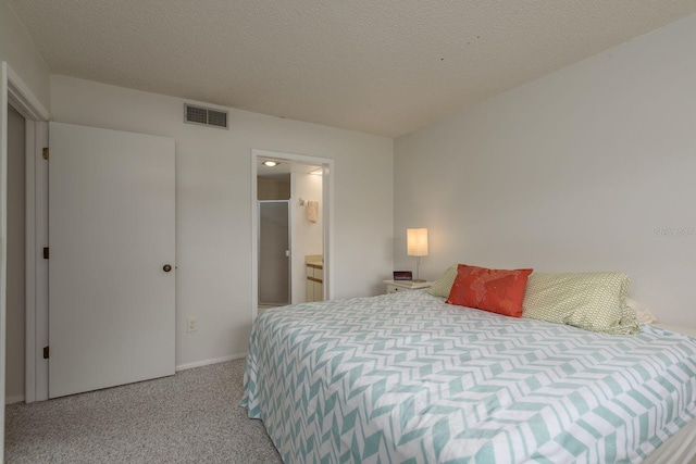 1241 S Martin Luther King Jr Ave Unit 302, Clearwater, FL 33756 - bedroom featuring light carpet, baseboards, and a textured ceiling