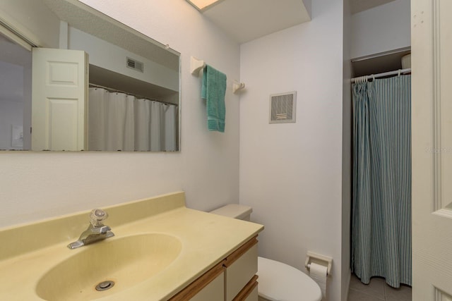 1241 S Martin Luther King Jr Ave Unit 302, Clearwater, FL 33756 - full bathroom featuring toilet, vanity, tile patterned flooring, and a shower with curtain