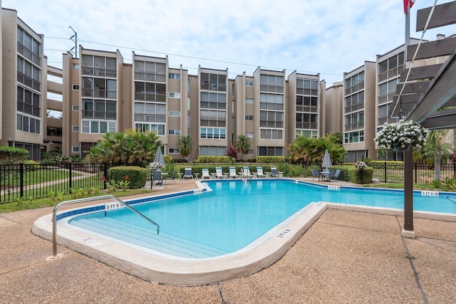 1241 S Martin Luther King Jr Ave Unit 302, Clearwater, FL 33756 - community pool with fence and a patio area