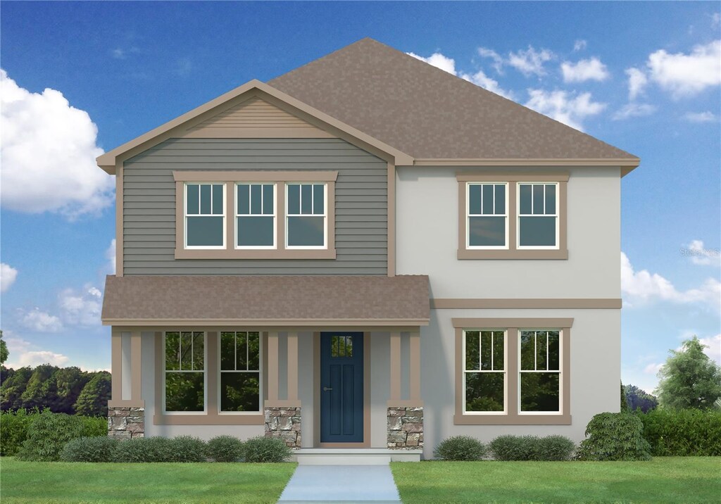 750 50th Ave N, Saint Petersburg, FL 33703 - view of front of house featuring a front lawn, stucco siding, and roof with shingles