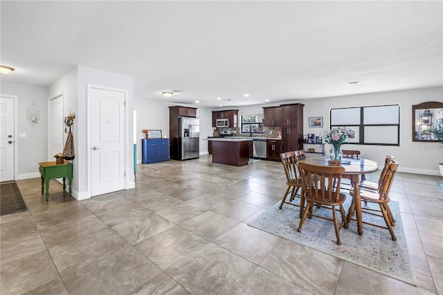 4821 S Gachet Blvd, Lakeland, FL 33813 - dining space with baseboards and recessed lighting