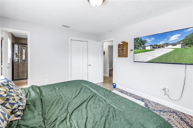 4821 S Gachet Blvd, Lakeland, FL 33813 - bedroom featuring a closet, carpet flooring, baseboards, and a textured ceiling