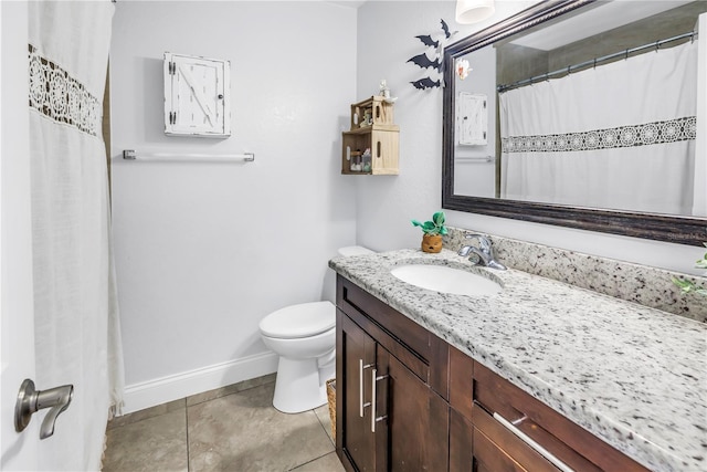 4821 S Gachet Blvd, Lakeland, FL 33813 - full bath with toilet, vanity, baseboards, and tile patterned flooring