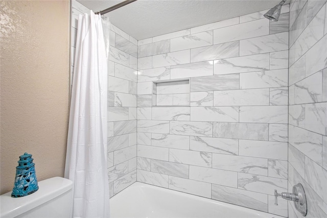 full bath with shower / bathtub combination with curtain, toilet, and a textured wall