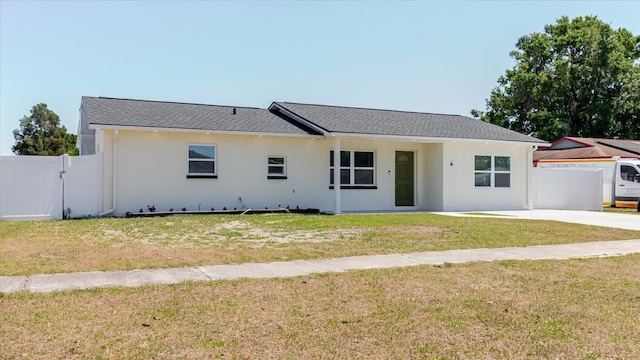 ranch-style home featuring stucco siding