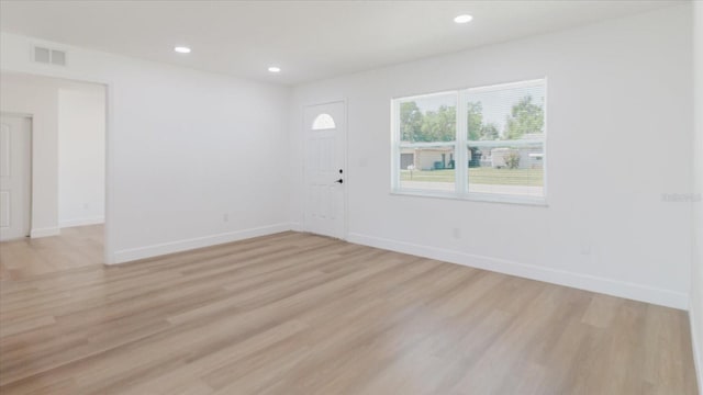 foyer entrance featuring light wood-type flooring, baseboards, and recessed lighting