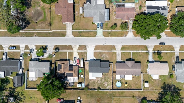 aerial view of property and surrounding area with nearby suburban area