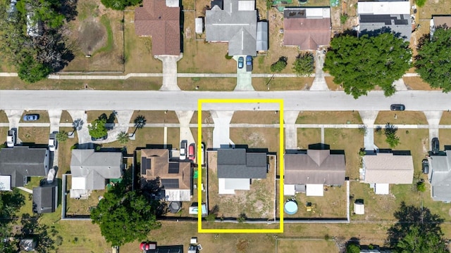 aerial overview of property's location featuring property boundaries highlighted and nearby suburban area