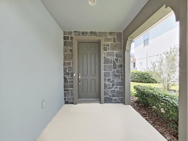 4063 Medicci Ln, Wesley Chapel, FL 33543 - property entrance with stone siding and stucco siding