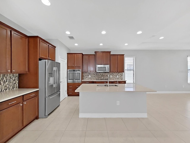 4063 Medicci Ln, Wesley Chapel, FL 33543 - kitchen with stainless steel appliances, a sink, tasteful backsplash, light countertops, and recessed lighting