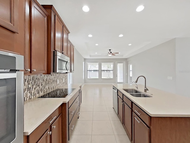 4063 Medicci Ln, Wesley Chapel, FL 33543 - kitchen with a sink, appliances with stainless steel finishes, light tile patterned floors, ceiling fan, and recessed lighting