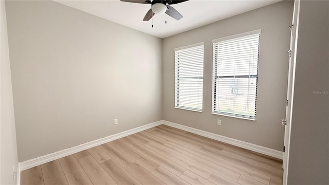 4063 Medicci Ln, Wesley Chapel, FL 33543 - unfurnished room with baseboards, light wood finished floors, and ceiling fan