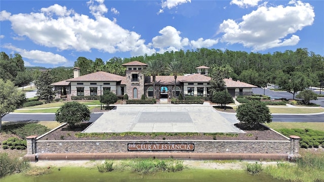 4063 Medicci Ln, Wesley Chapel, FL 33543 - back of house featuring stone siding