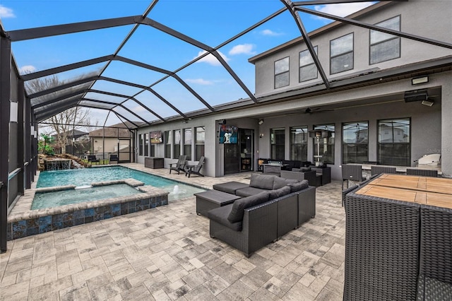 view of swimming pool with an outdoor living space, a patio area, a pool with connected hot tub, a ceiling fan, and glass enclosure