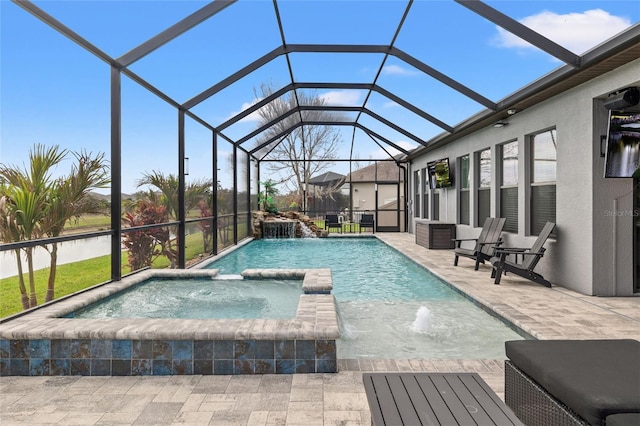 view of pool featuring a patio, a pool with connected hot tub, and a lanai