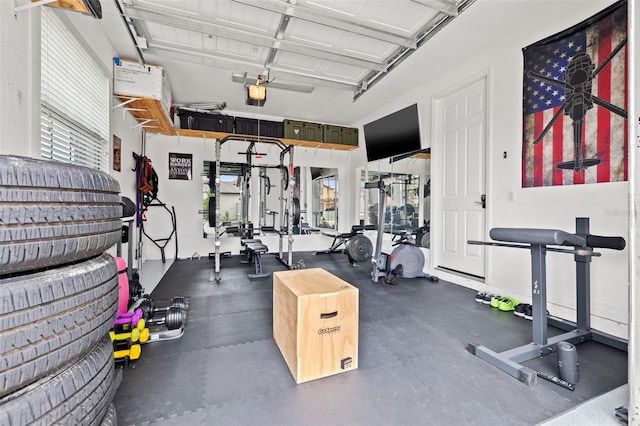 exercise room featuring plenty of natural light and a garage