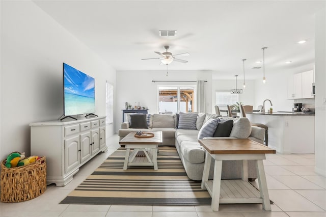 6398 Bar S Bar Trl, Zephyrhills, FL 33541 - living area featuring ceiling fan, light tile patterned floors, and recessed lighting