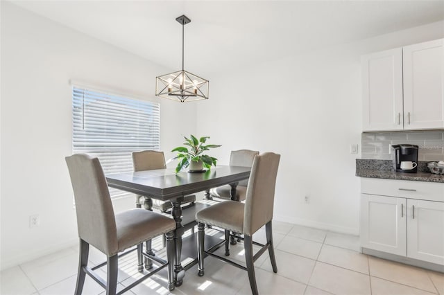 6398 Bar S Bar Trl, Zephyrhills, FL 33541 - dining room featuring baseboards, a chandelier, and light tile patterned flooring