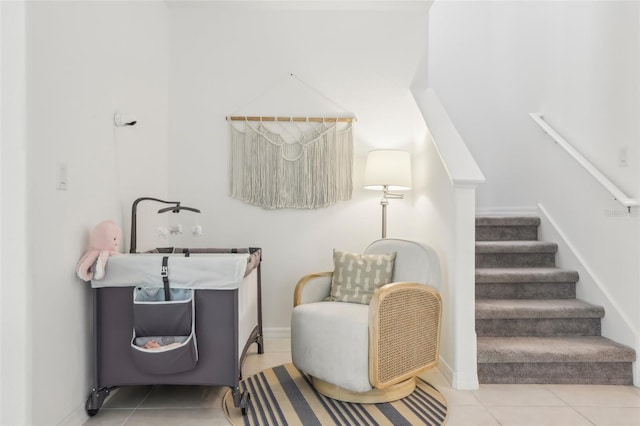 6398 Bar S Bar Trl, Zephyrhills, FL 33541 - living area featuring tile patterned floors, stairway, and baseboards