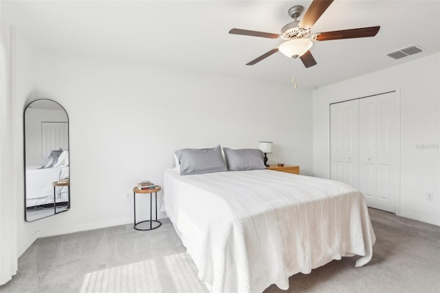 6398 Bar S Bar Trl, Zephyrhills, FL 33541 - carpeted bedroom with baseboards, a ceiling fan, and a closet