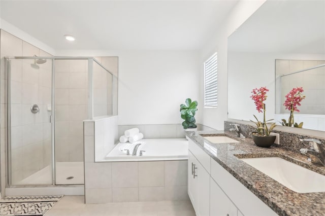 6398 Bar S Bar Trl, Zephyrhills, FL 33541 - full bathroom featuring a stall shower, a bath, tile patterned flooring, double vanity, and recessed lighting