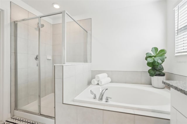 6398 Bar S Bar Trl, Zephyrhills, FL 33541 - full bath with a stall shower and a garden tub
