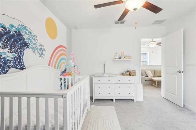 6398 Bar S Bar Trl, Zephyrhills, FL 33541 - carpeted bedroom featuring a crib and a ceiling fan