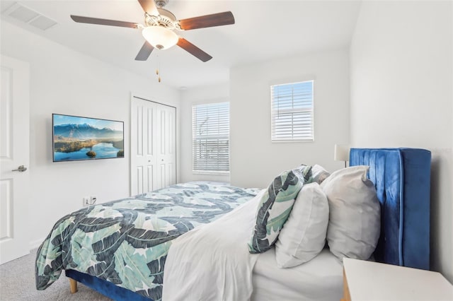 6398 Bar S Bar Trl, Zephyrhills, FL 33541 - bedroom with carpet, a closet, and ceiling fan