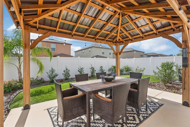 6398 Bar S Bar Trl, Zephyrhills, FL 33541 - view of patio featuring a fenced backyard, a gazebo, and outdoor dining space