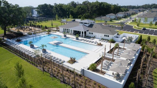 6398 Bar S Bar Trl, Zephyrhills, FL 33541 - community pool featuring fence and a patio area