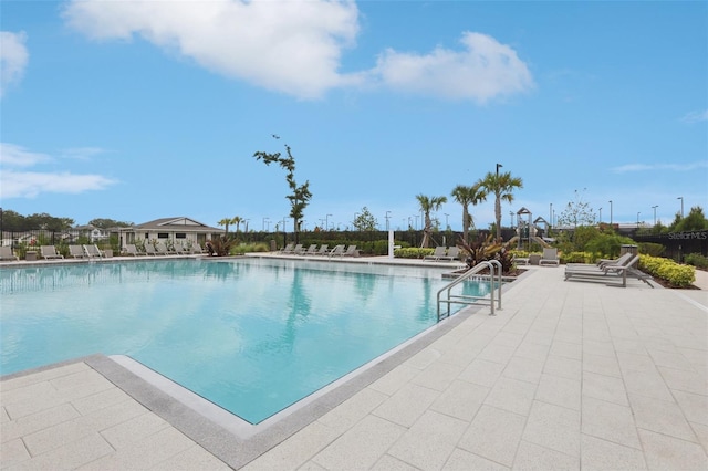 6398 Bar S Bar Trl, Zephyrhills, FL 33541 - community pool with a patio