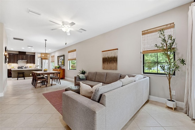3877 Burdick Loop, Odessa, FL 33556 - living area with light tile patterned floors, ceiling fan, baseboards, and recessed lighting