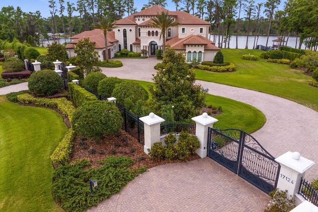 17124 Crawley Rd, Odessa, FL 33556 - surrounding community with a gate, a water view, and curved driveway