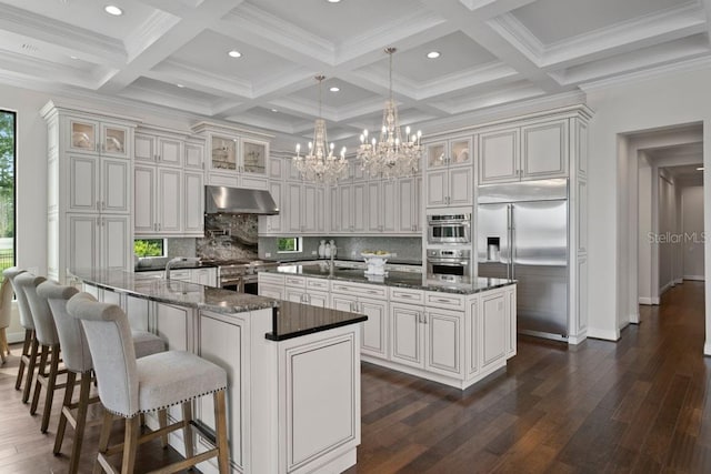 17124 Crawley Rd, Odessa, FL 33556 - kitchen with premium appliances, a large island, decorative backsplash, dark wood-type flooring, and beamed ceiling