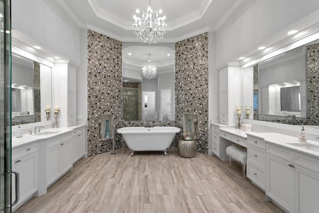 17124 Crawley Rd, Odessa, FL 33556 - full bath with a chandelier, a stall shower, ornamental molding, a raised ceiling, and two vanities